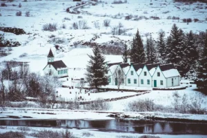 This serene view captures the dramatic rift valley of Þingvellir, where the Eurasian and North American tectonic plates continue to separate. The crystal-clear water, rugged lava formations and panoramic landscapes make this one of the most iconic sights on the Golden Circle. A perfect stop for photography and geological exploration