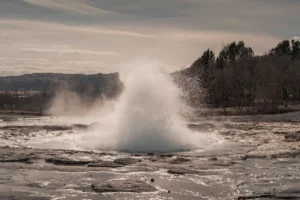 Strokkur geyser erupting in the Geysir geothermal area, Iceland