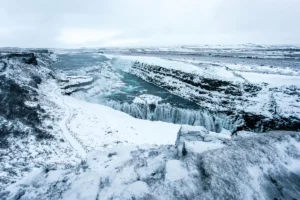Gullfoss waterfall covered in snow and ice during winter in Iceland