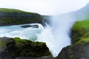 Mist rising over the powerful Gullfoss waterfall canyon on the Golden Circle