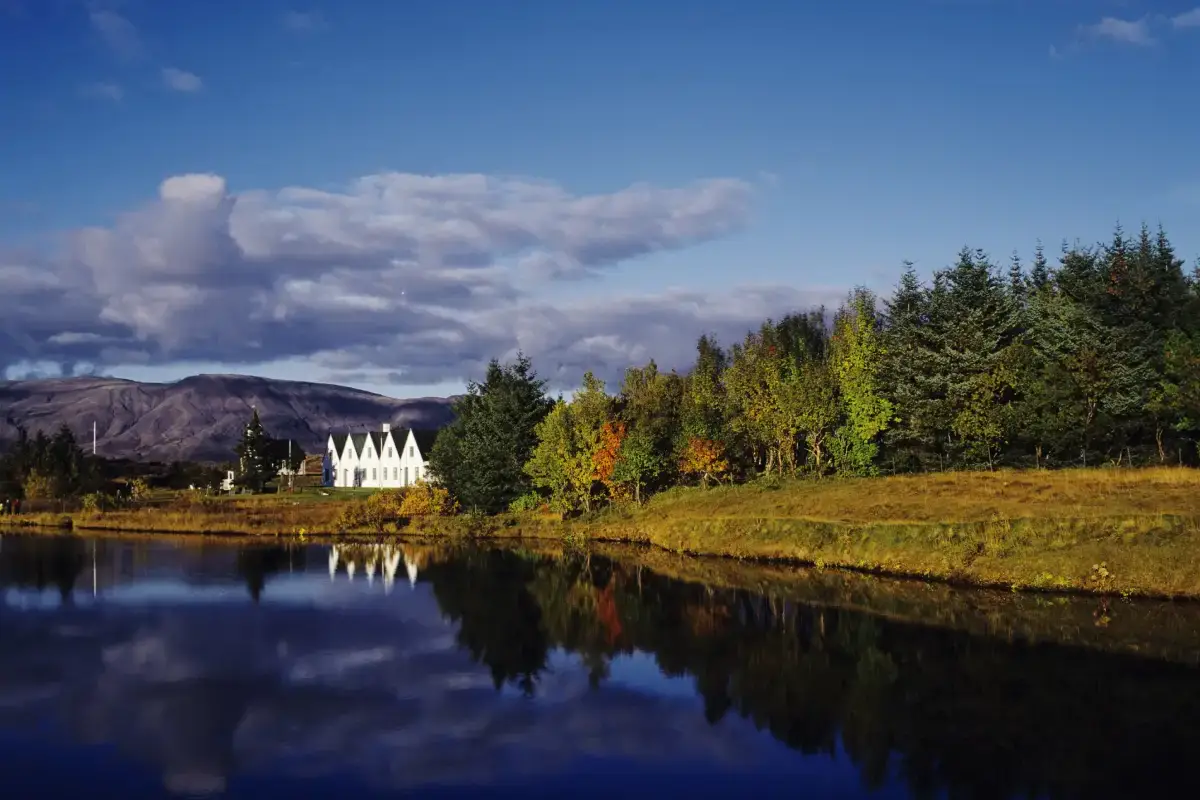 Þingvellir National Park with Þingvellir Church by the water on a calm day