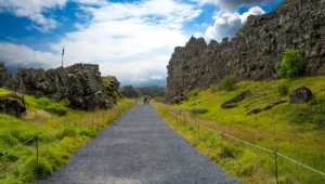 People walking on a path through Almannagjá gorge in Þingvellir National Park