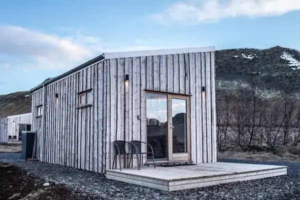 Cozy wooden cottage at Arngrímslundur surrounded by Icelandic countryside near the Golden Circle