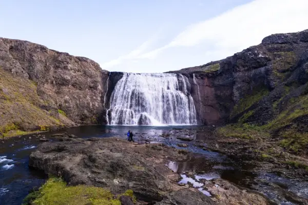 Scenic view of Þórufoss waterfall cascading into a rocky canyon in Iceland