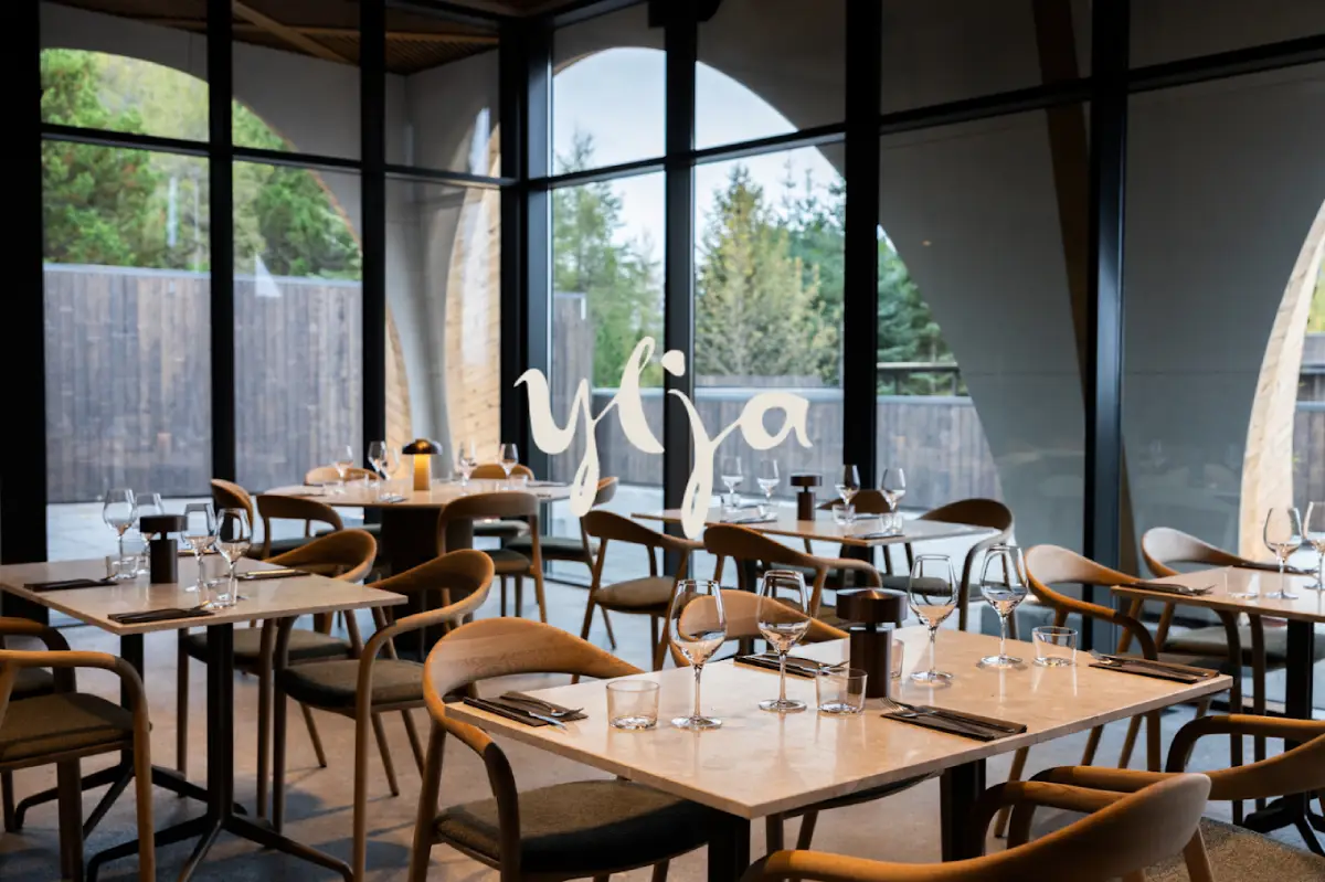 Interior of Ylja Restaurant near Gullfoss, Golden Circle, Iceland, featuring modern Nordic dining design and set tables