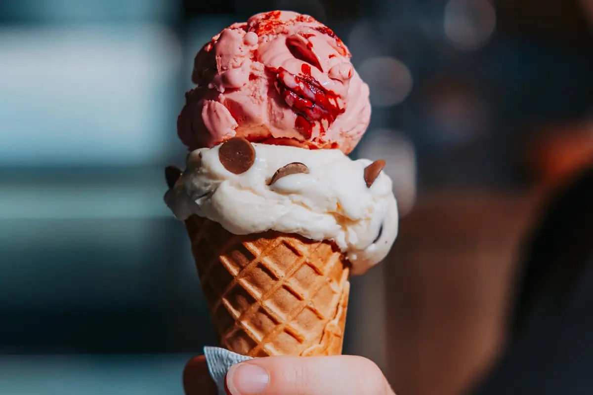 Ice cream cone with strawberry and vanilla scoops from Efstidalur farm in Iceland