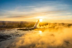 Steam rising from hot springs at Geysir geothermal area in Iceland