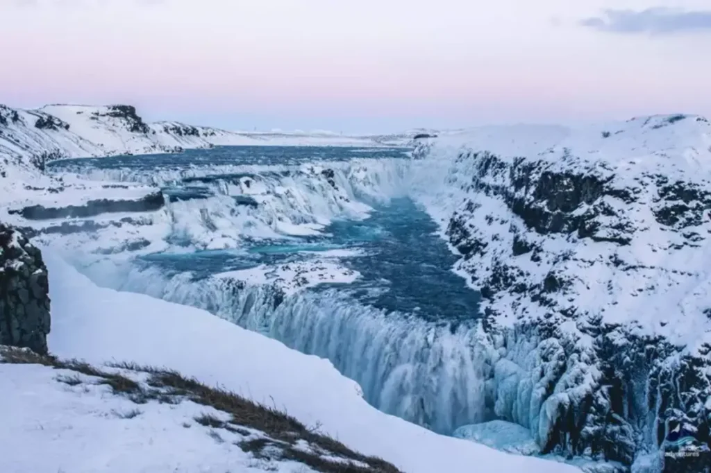 Gullfoss waterfall in winter covered in snow and ice on Iceland’s Golden Circle
