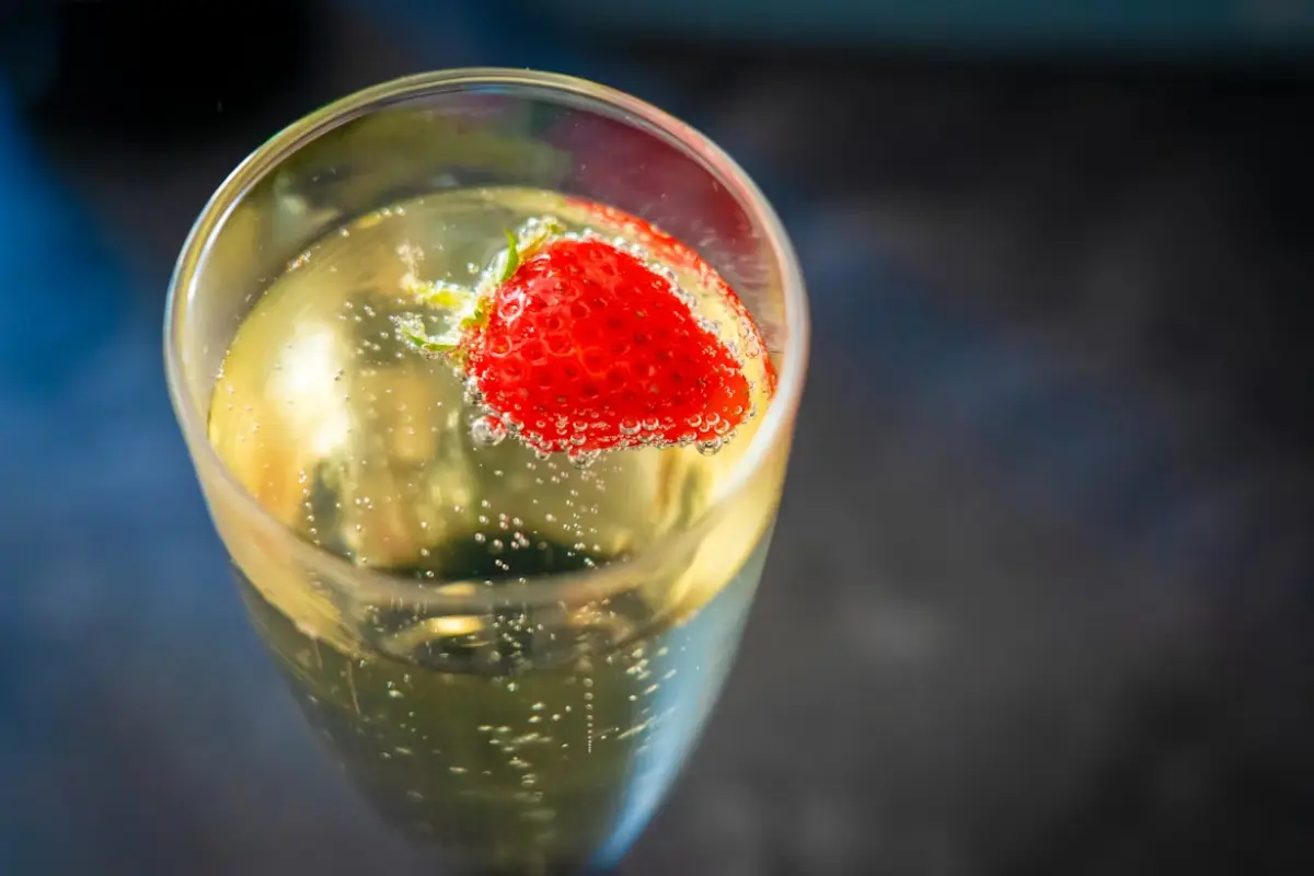 A glass of champagne with a strawberry, celebrating a special occasion in Iceland