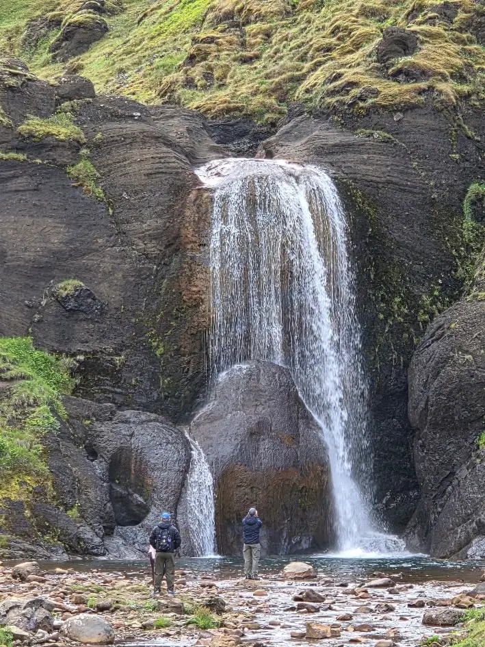 Helgufoss waterfall falling over dark rock near the Golden Circle in Iceland